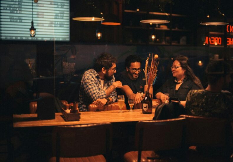 Group of people hanging out in a bar